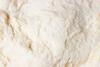 A close-up photograph of raw yeast dough