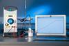 Chemistry equipment with a data logger, thermometer and a laptop recording an increasing temperature on a graph