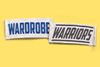 Clothing labels showing the words Wardrobe Warriors