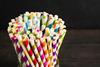 lots of colourful stripy paper straws in a jar